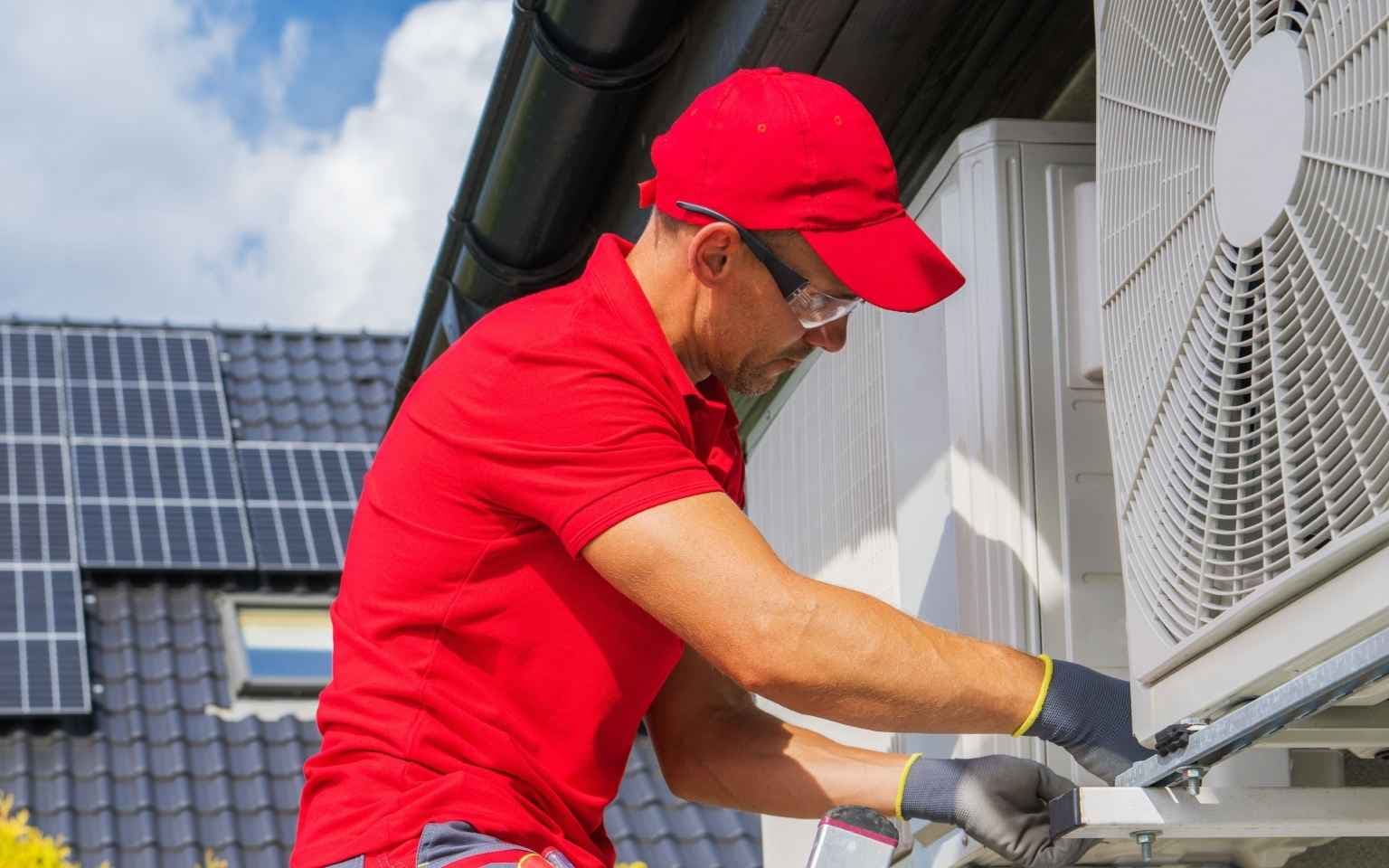 Hvac professional working on site | ServiceForge
