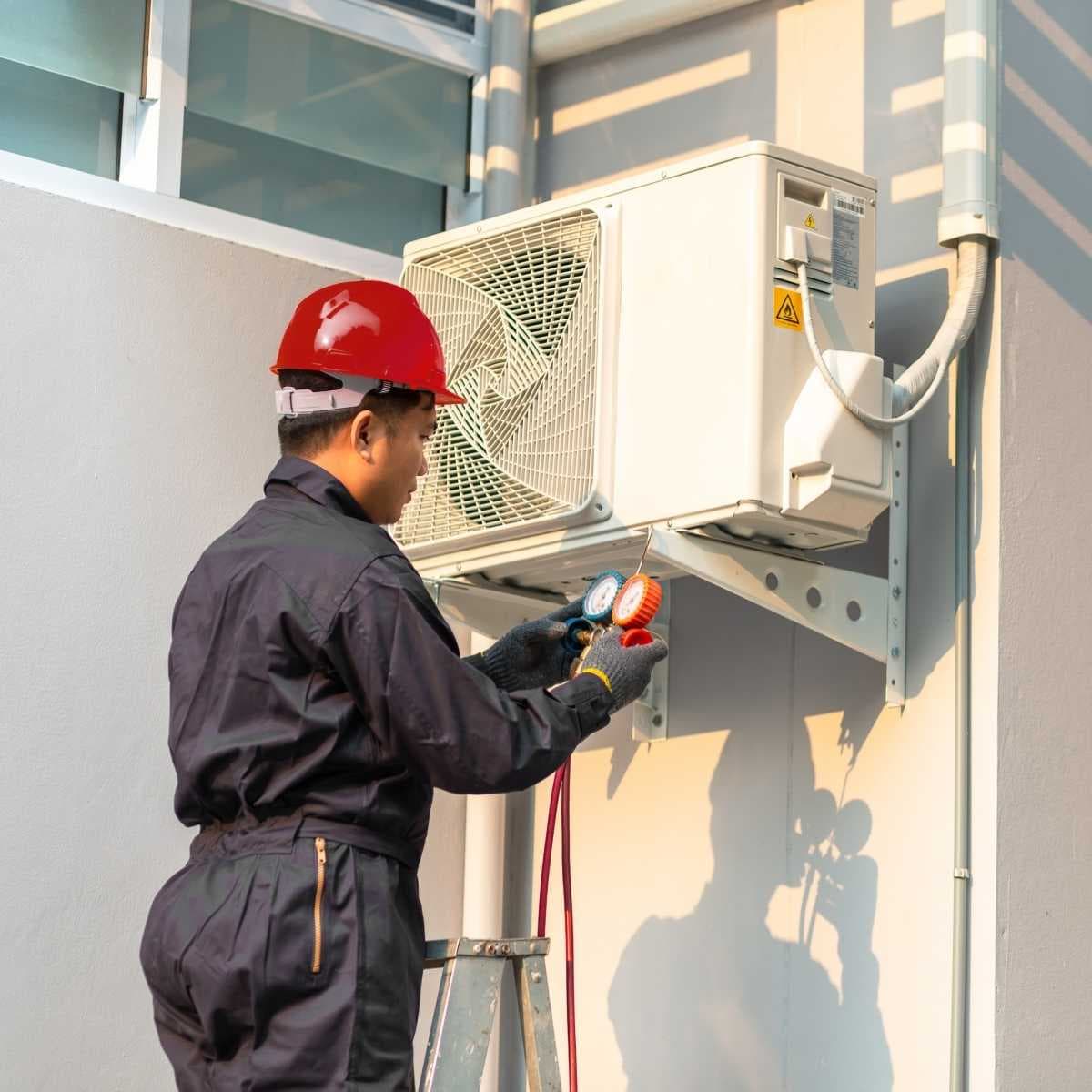 HVAC professional while diagnosing