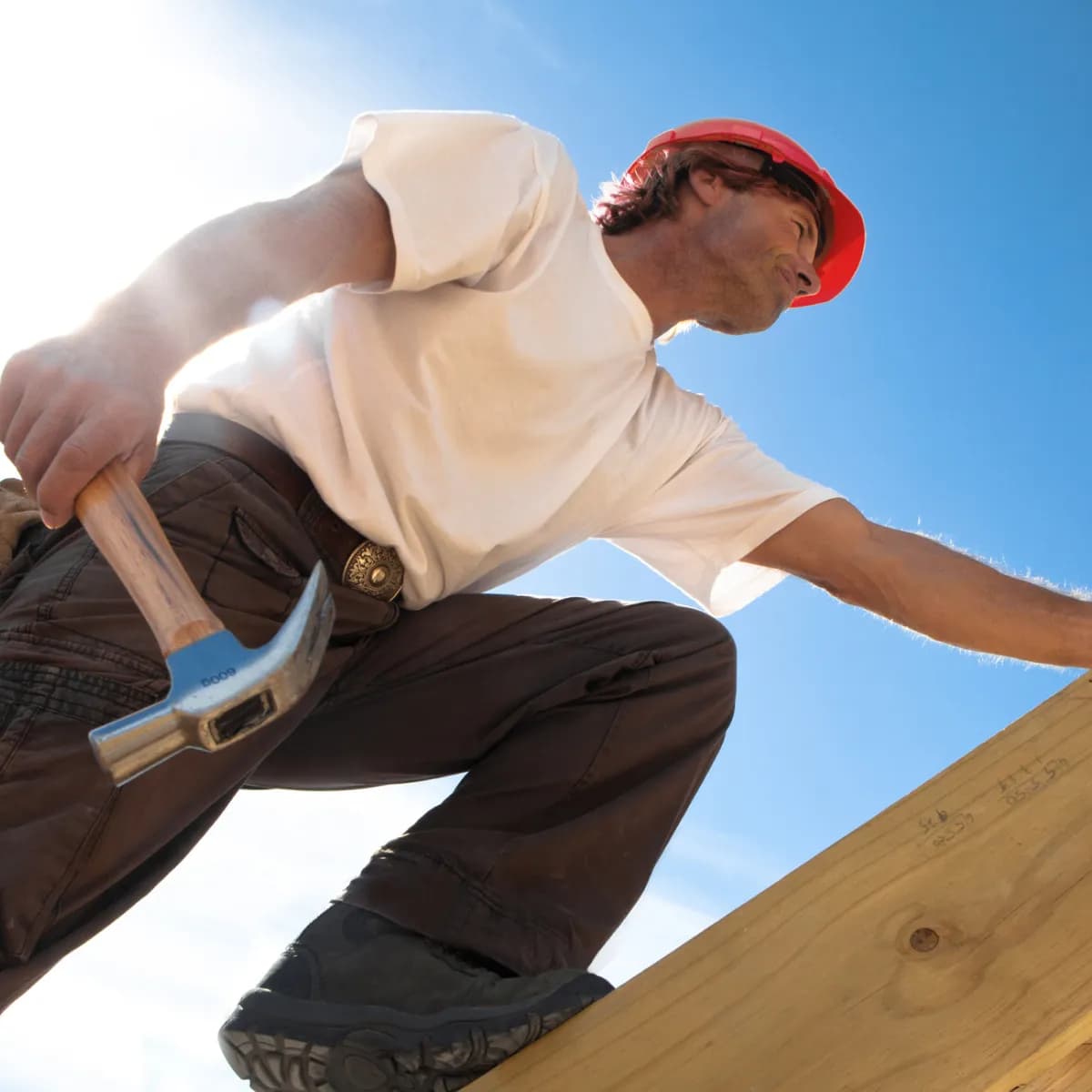 roofing professional climbing in the roof
